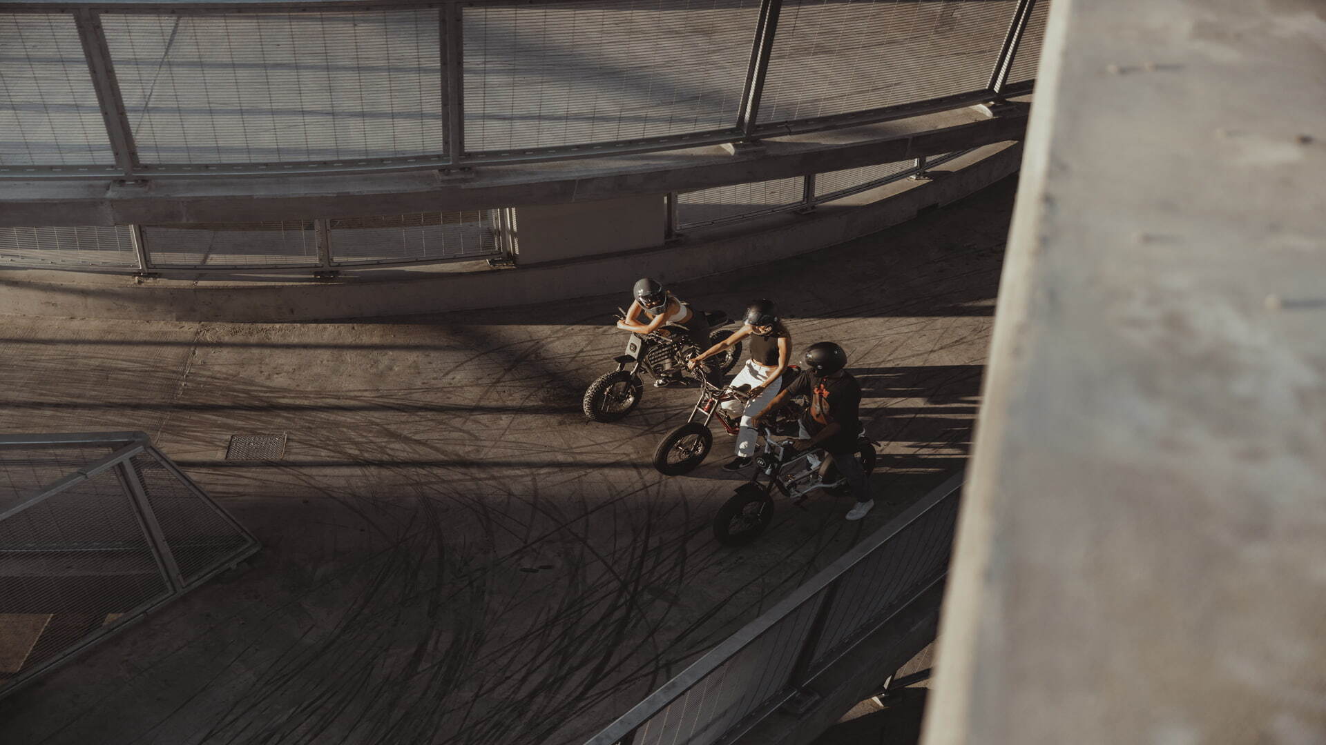 A shot from above of three women driving a Super73 bikes