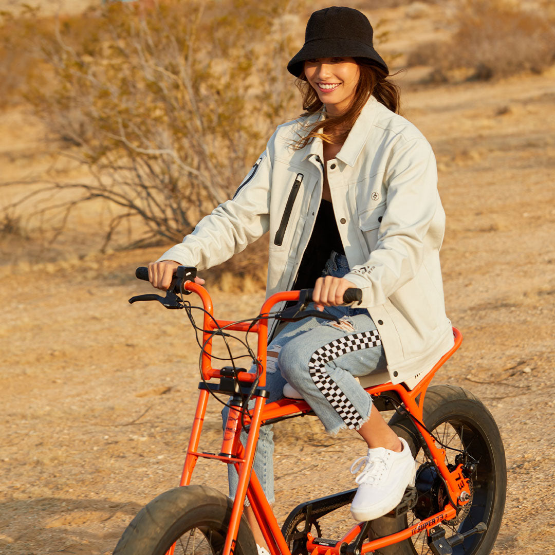 Model wearing a Super73 and Field Research Division Collection Anvil Jacket