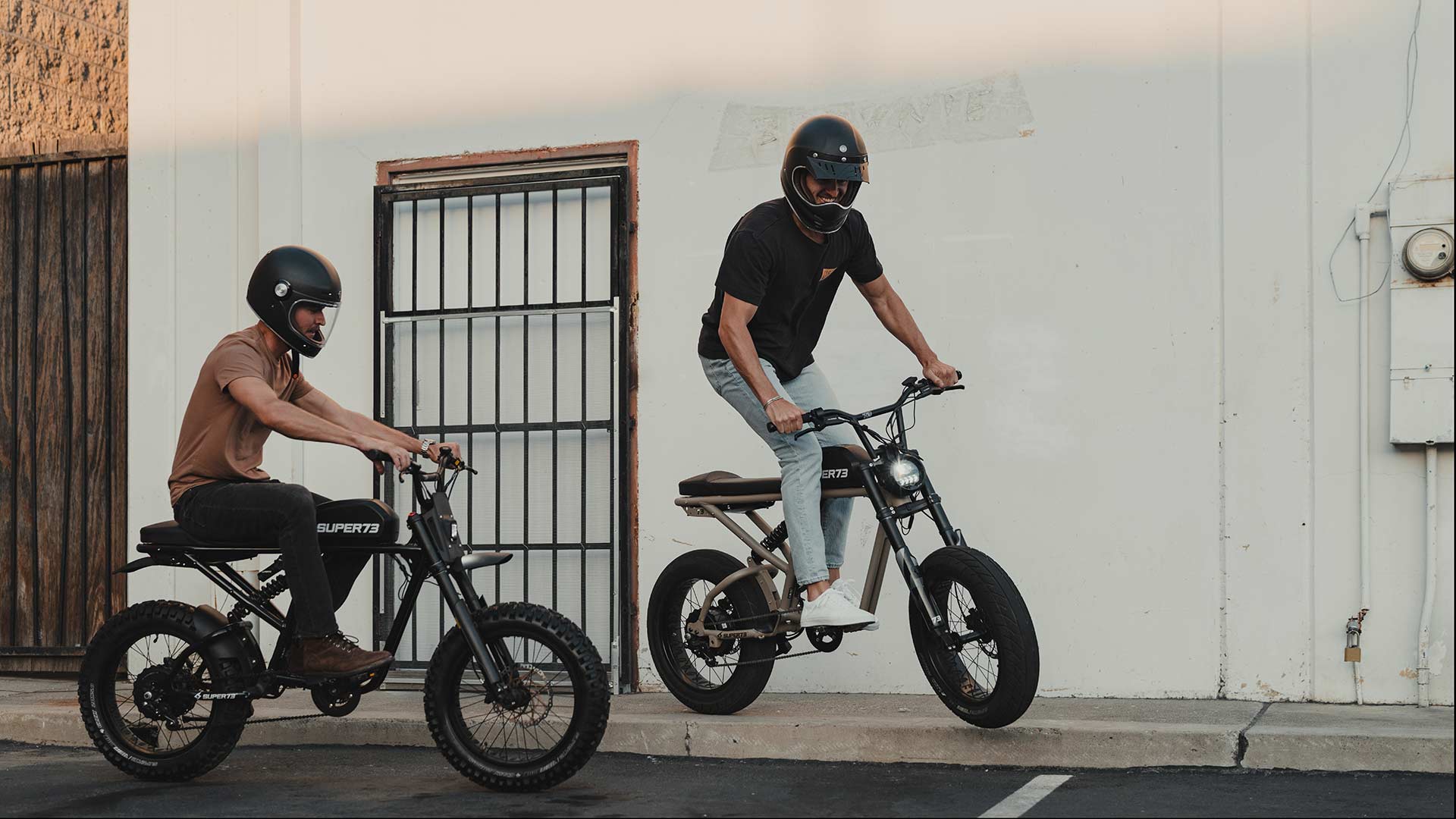 Two men riding Super73-RX bikes