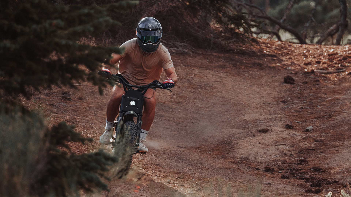 Rider on dirt trail pushing the limits of their Super73 ebike
