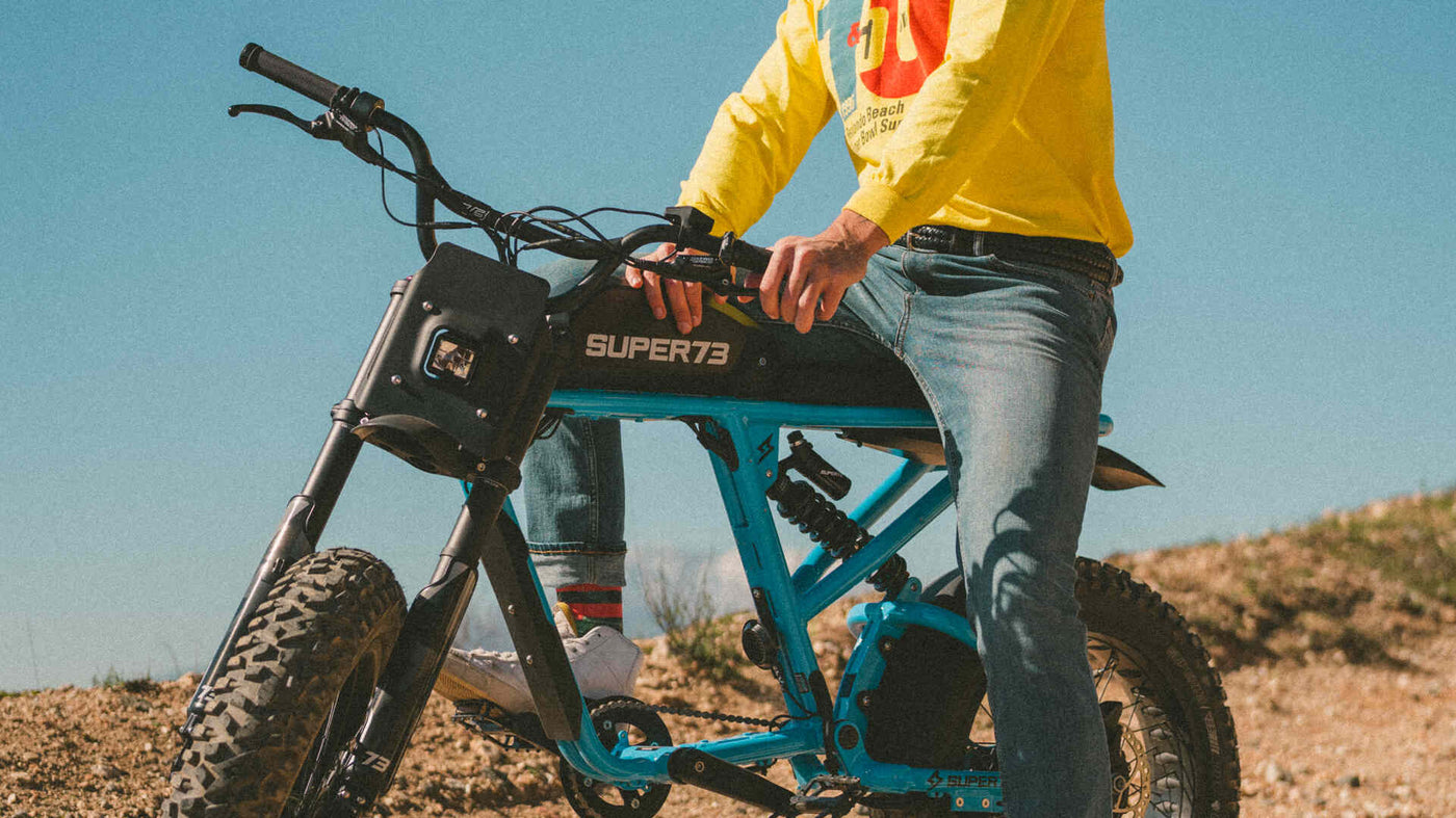 Man riding a Super73-RX Blu Tang in the desert